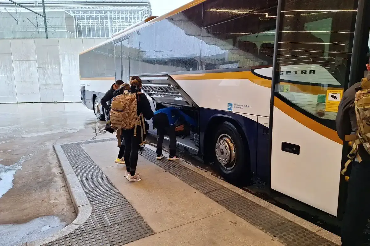 Pilgrims boarding a bus