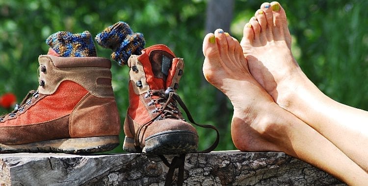 Trekking boots and nude feet