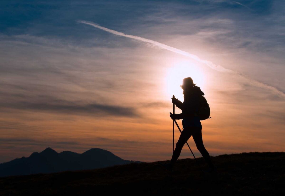 Pilgrim walking in the light of dawn