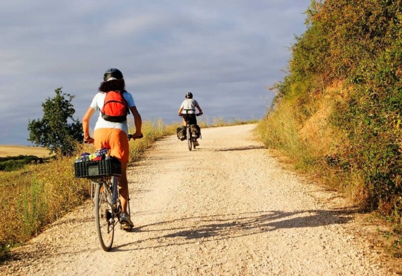 Two pilgrims cycling through León