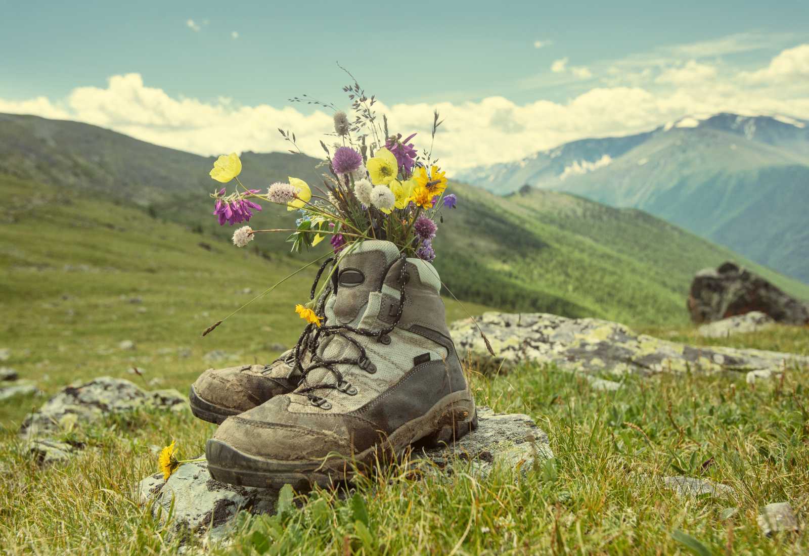 Boots with flowers in springtime.